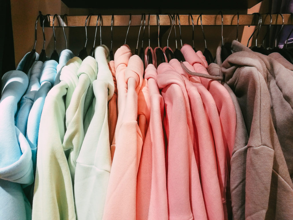 colorful hoodies and t shirts hanging